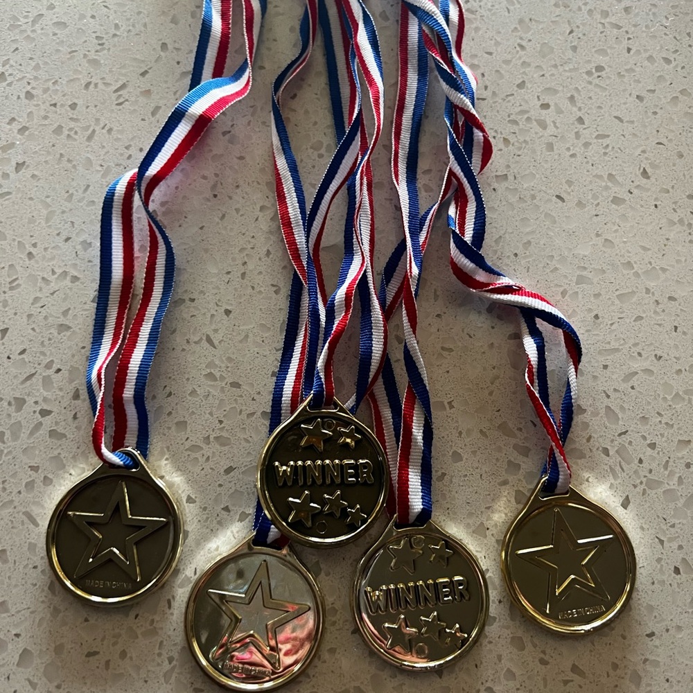 Gold Winner Medals with Red, White, and Blue Ribbons